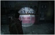 Both the workbench and the training manual are located in the same room (Image via Trophygamers/YouTube)